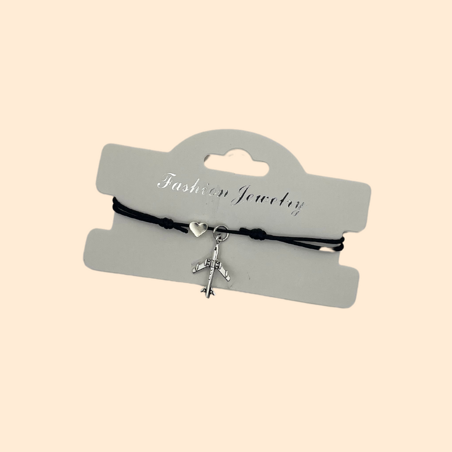 Bracelet argenté avec motif cœur et avion